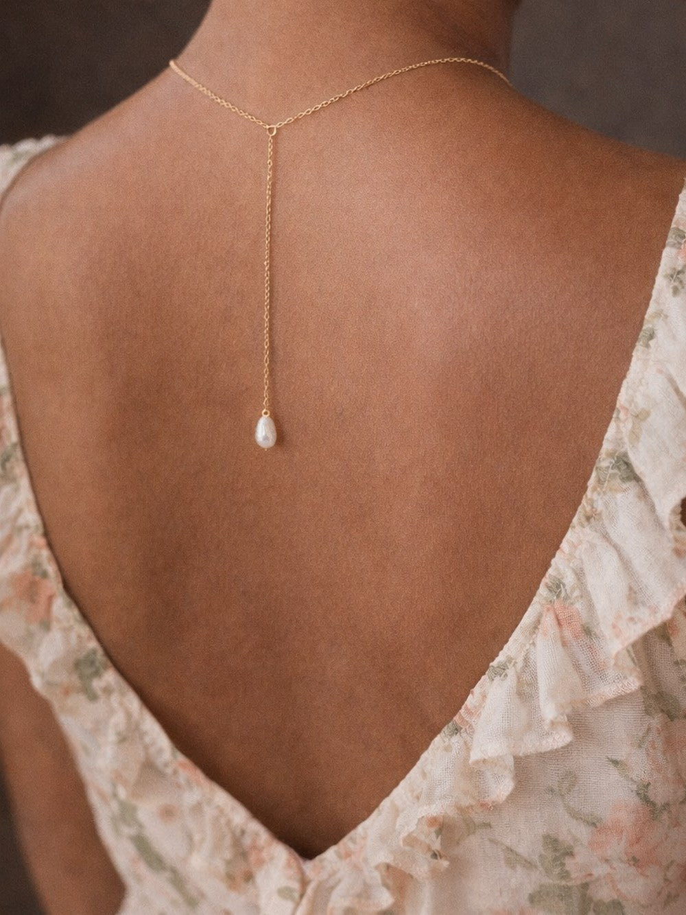 Collier de dos Asmin